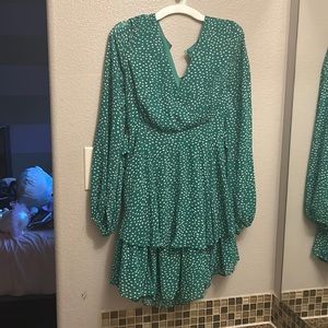green polka dotted ruffled dress